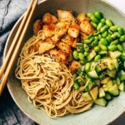 Noodles with chicken and veggies on a plate.