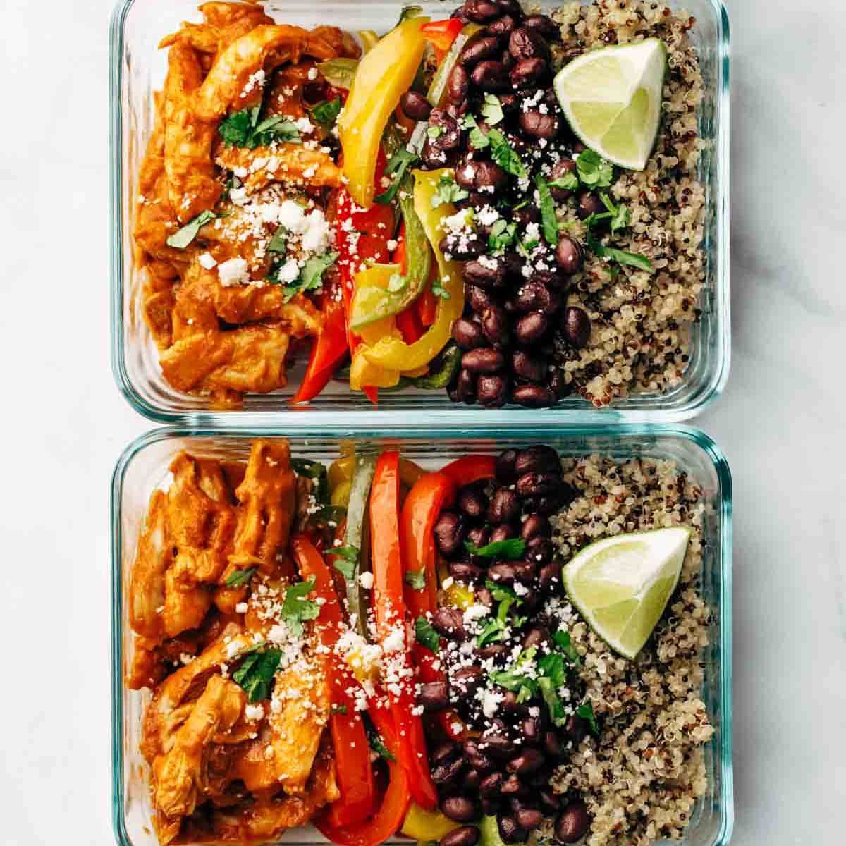Chicken with peppers and beans and rice in a pan.