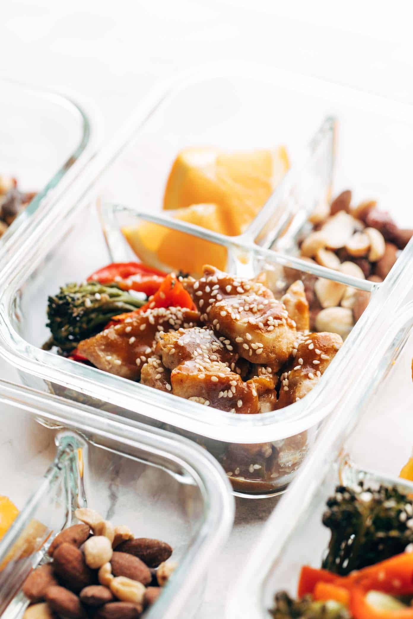 Sheet Pan Garlic Ginger Chicken and Broccoli in a clear container.