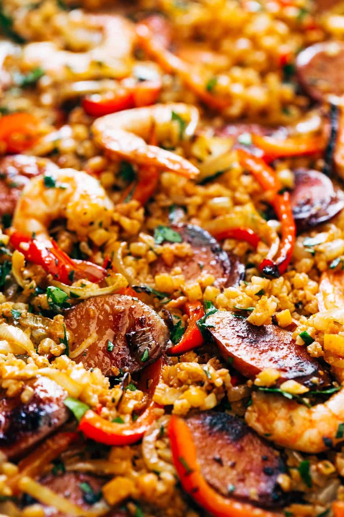 Jambalaya spread out n a sheet pan.