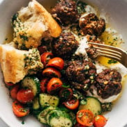 Sheet pan meatballs with bread and a tomato salad