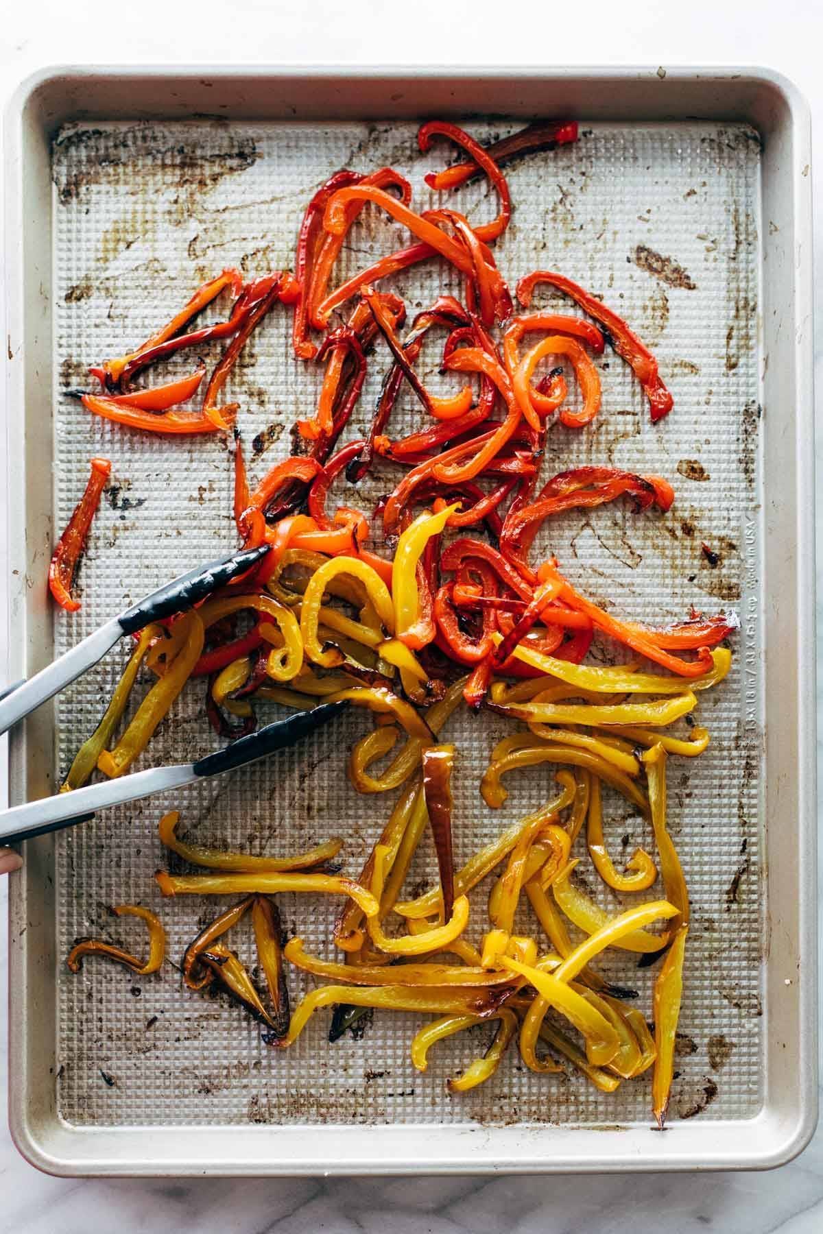 Roasted peppers in a sheet pan.