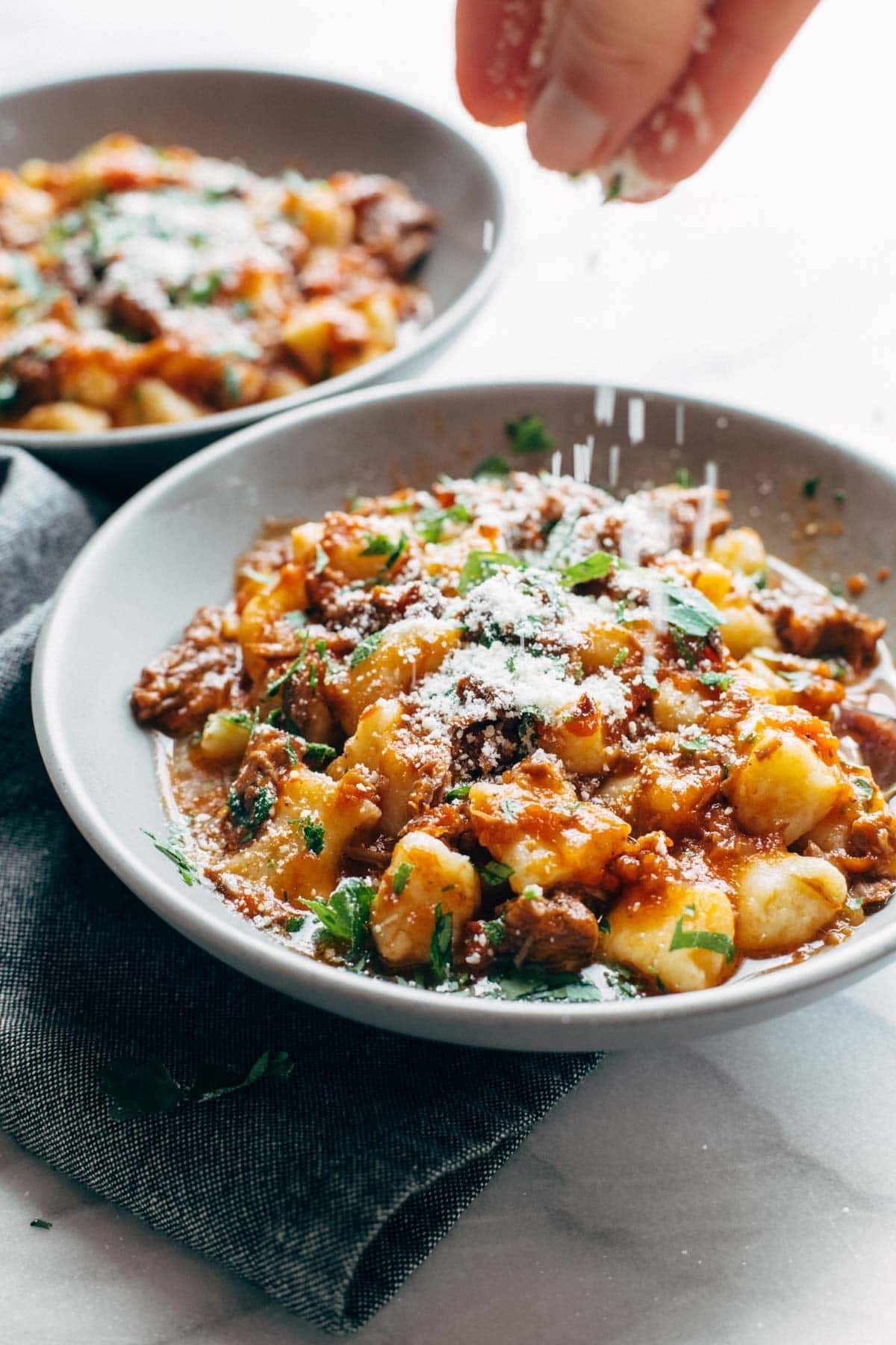 Short rib ragu in a bowl with gnocchi.