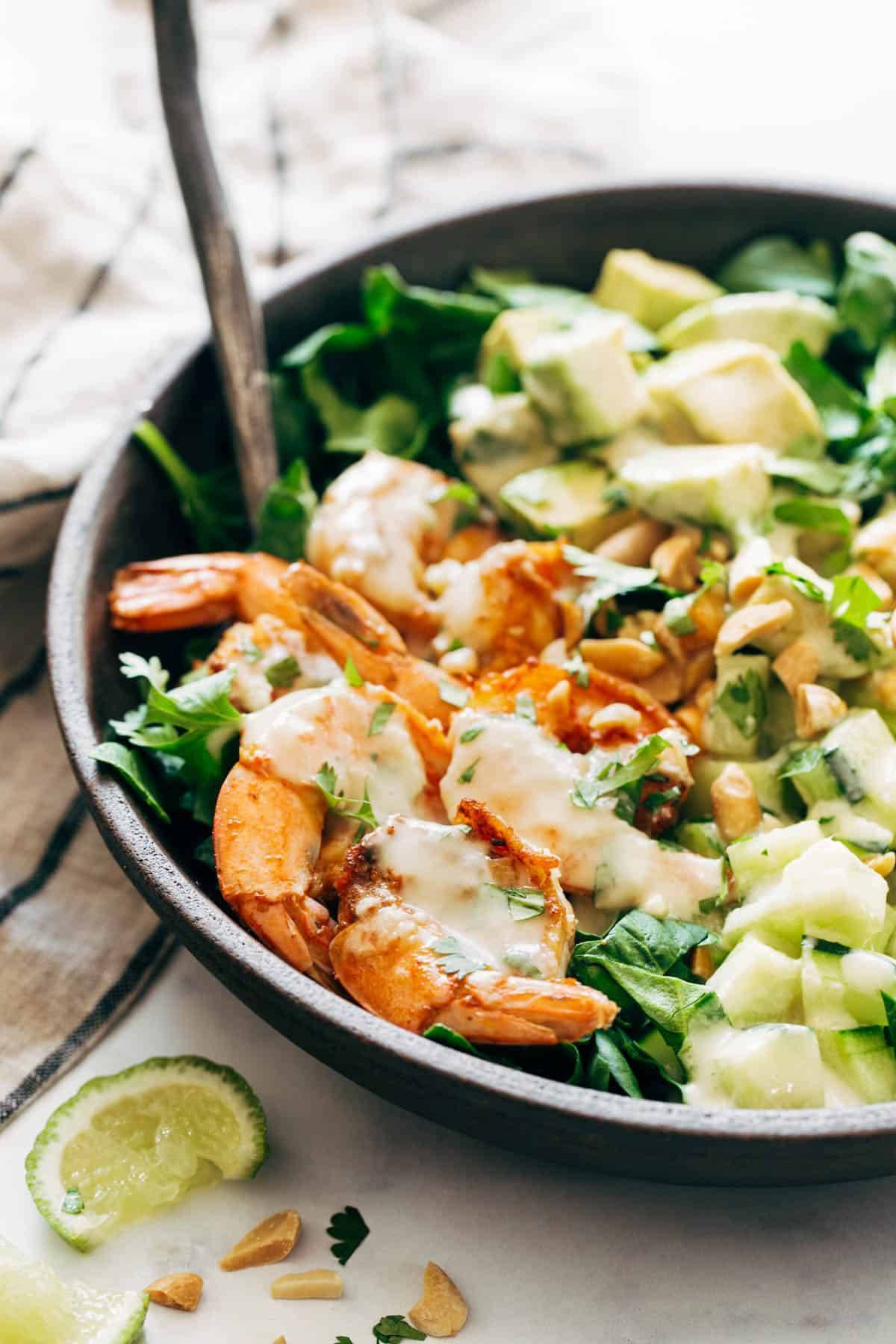 Close-up of Shrimp and Avocado Salad with Miso Dressing in a bowl.