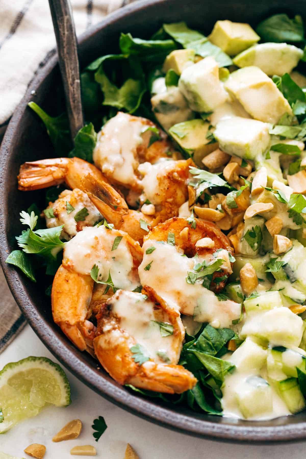 Shrimp and Avocado Salad with Miso Dressing in a bowl. 