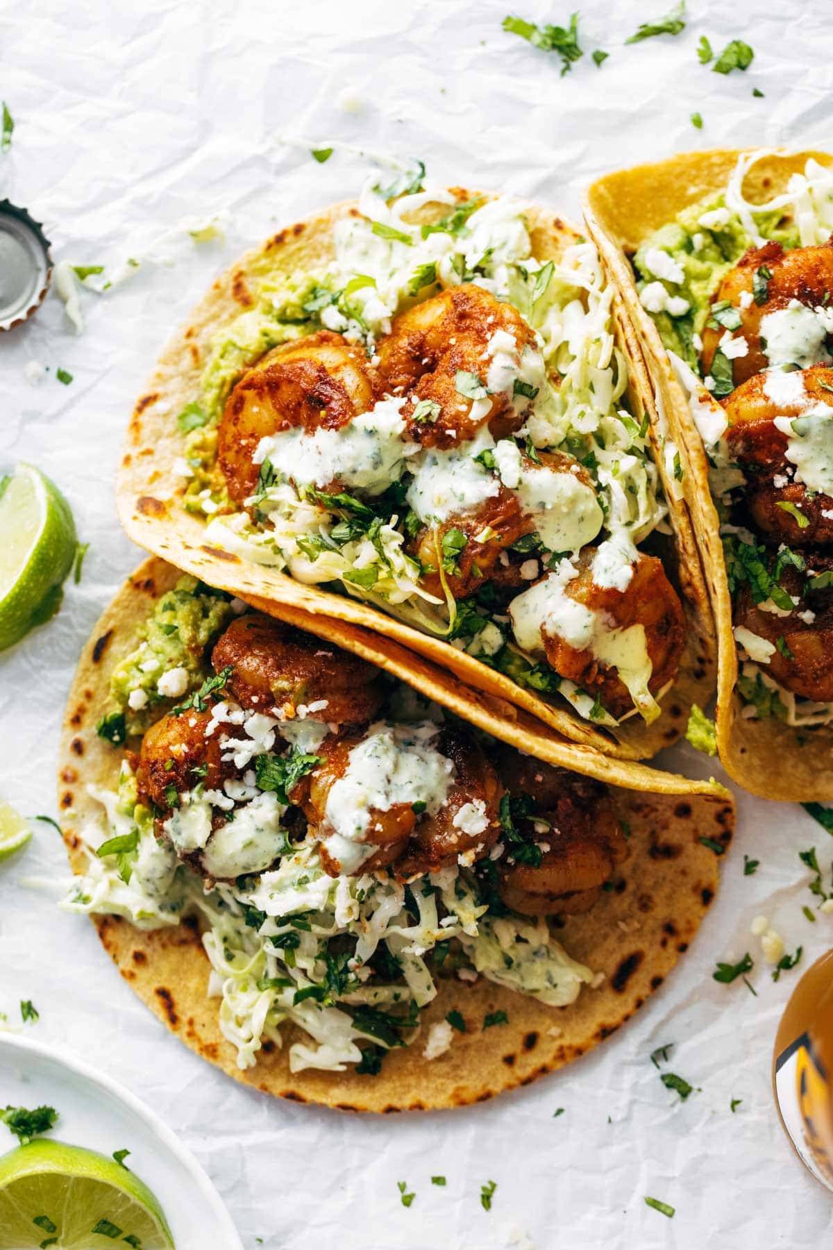 Spicy shrimp tacos with sauce.