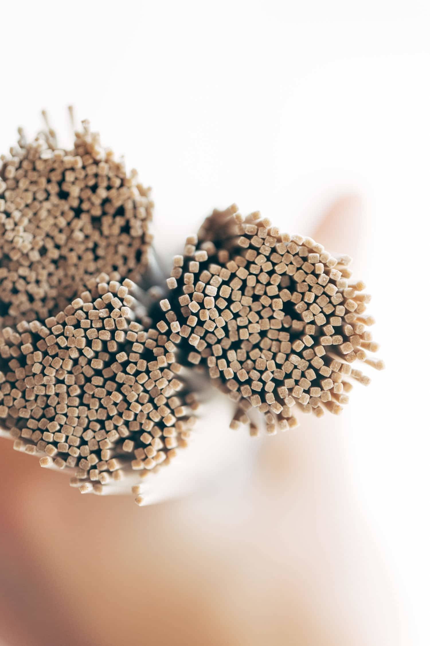 Soba noodles in bunches.