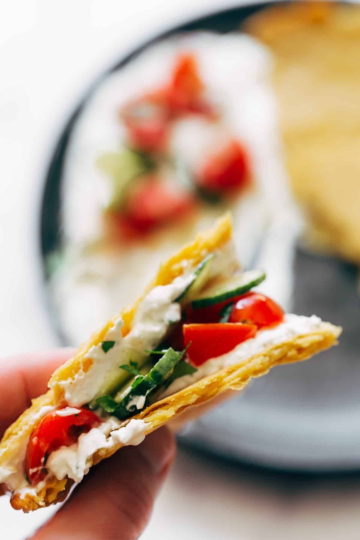Crispy socca with feta and tomatoes.