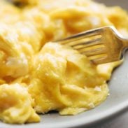 Soft Scrambled Eggs on plate with fork.