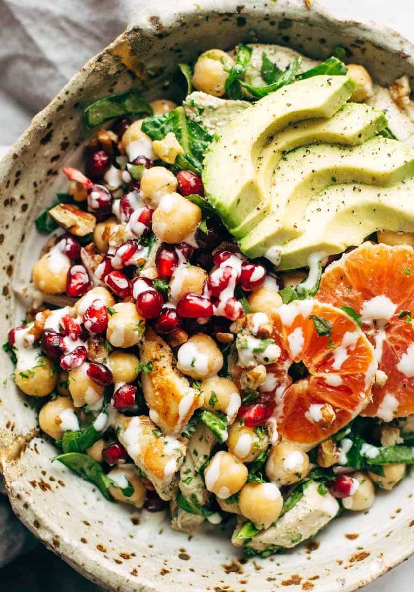 Winter Spa salad in a bowl with chickpeas, avocado, and oranges.