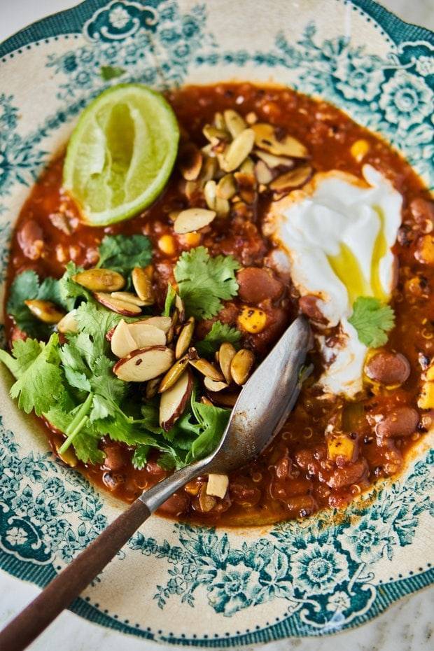 A pretty decorative blue bowl of taco soup.