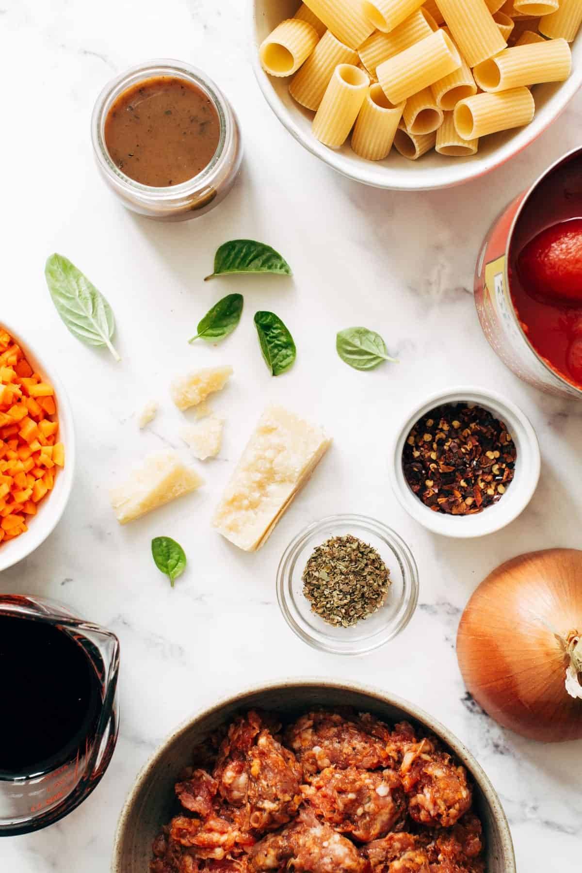 Ingredients in bowls for Spicy Sausage Rigatoni.