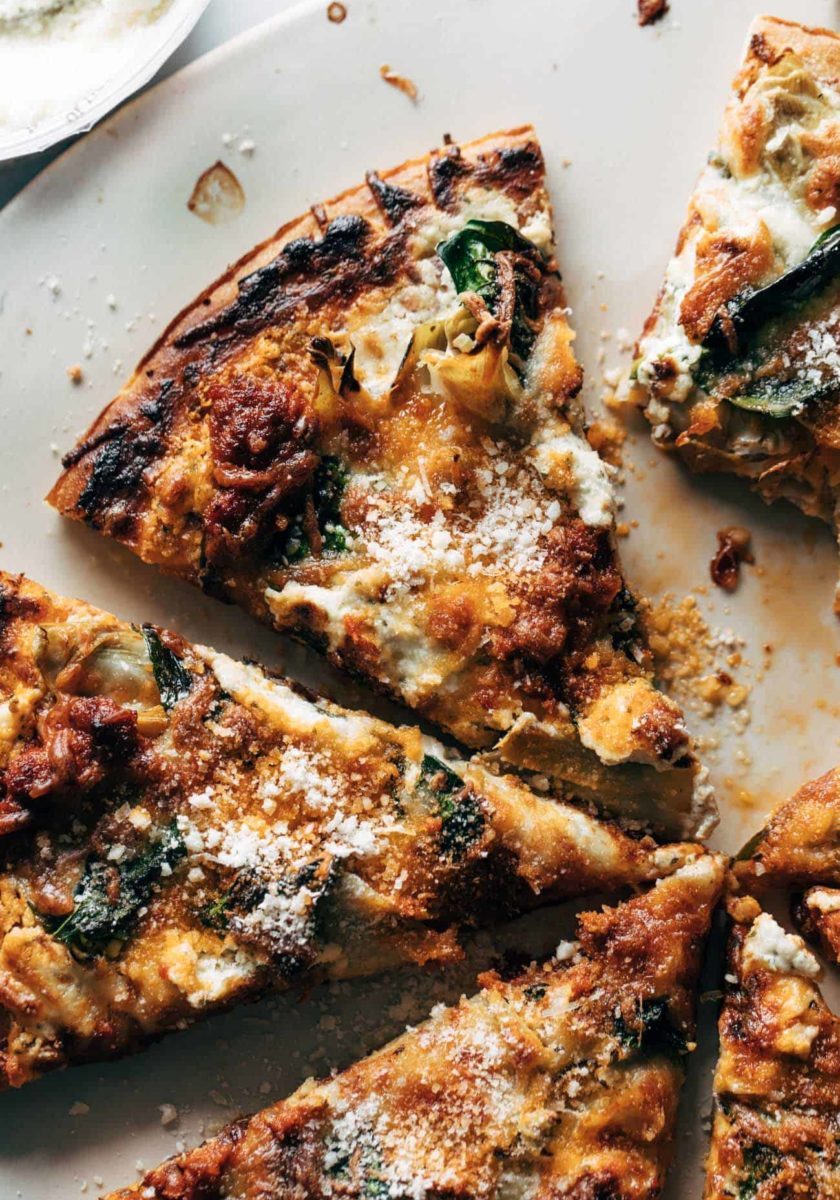 Slices of pizza sitting on a pizza pan.