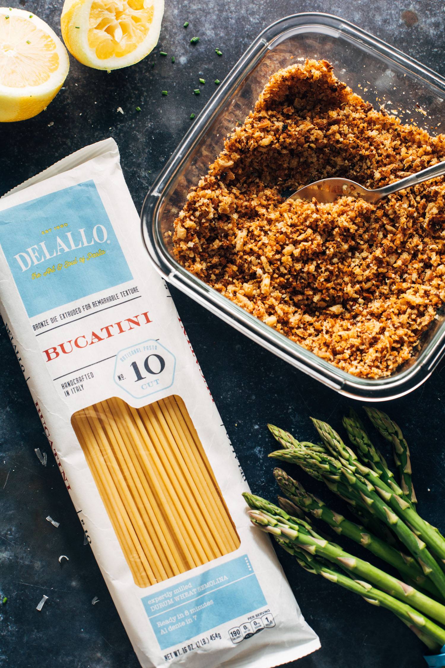 On top of pasta, bread crumbs and asparagus