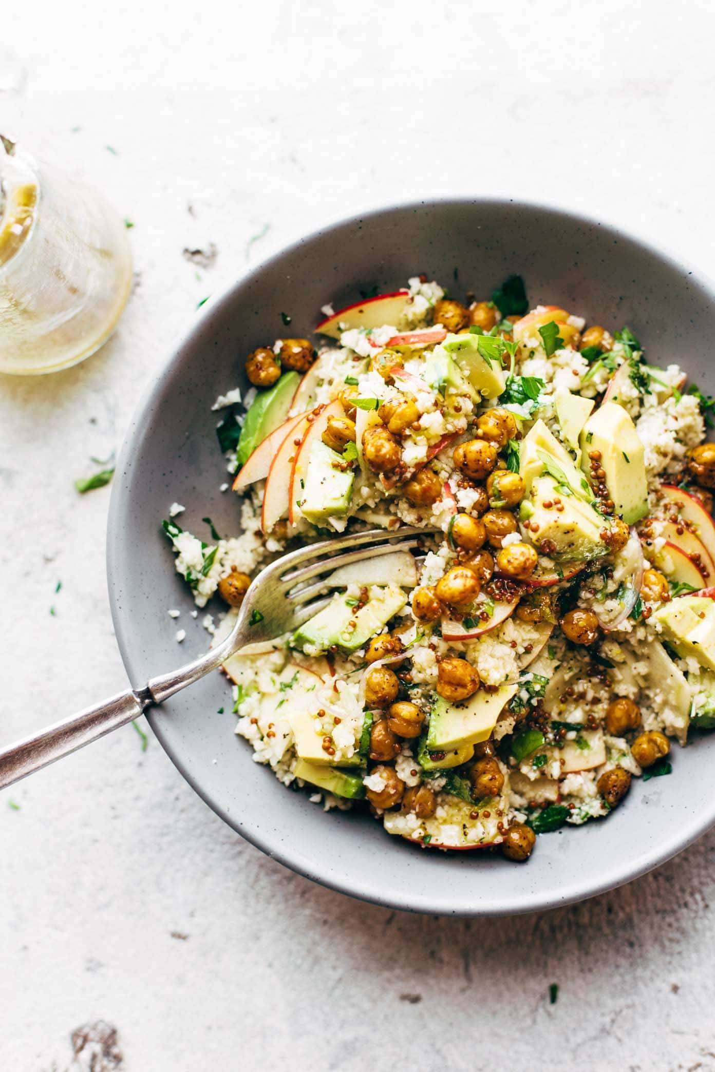 Spring Detox Cauliflower Salad in a bowl with a fork.