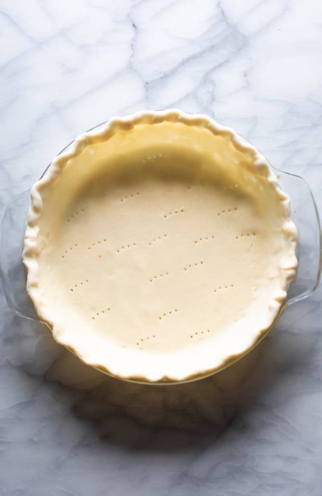 Uncooked pie crust in a pan.