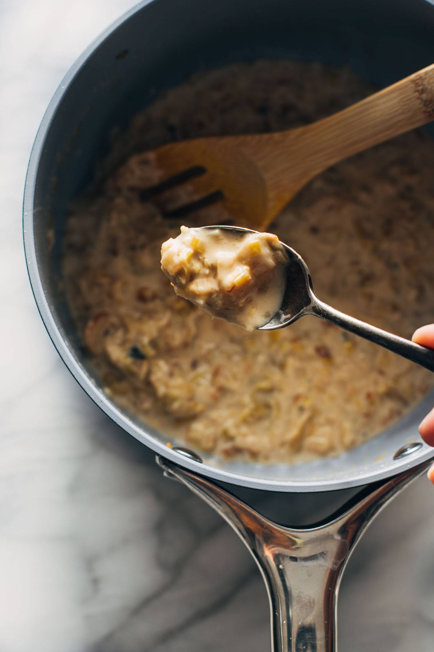 Spoon cooked leek sauce on the pan