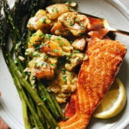 Spring salmon on a plate with asparagus, leeks, and potatoes square