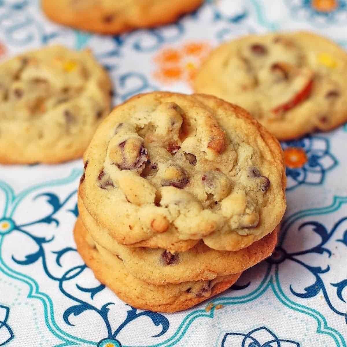 Peanut butter pretzel cookies on a colorful piece of fabric.