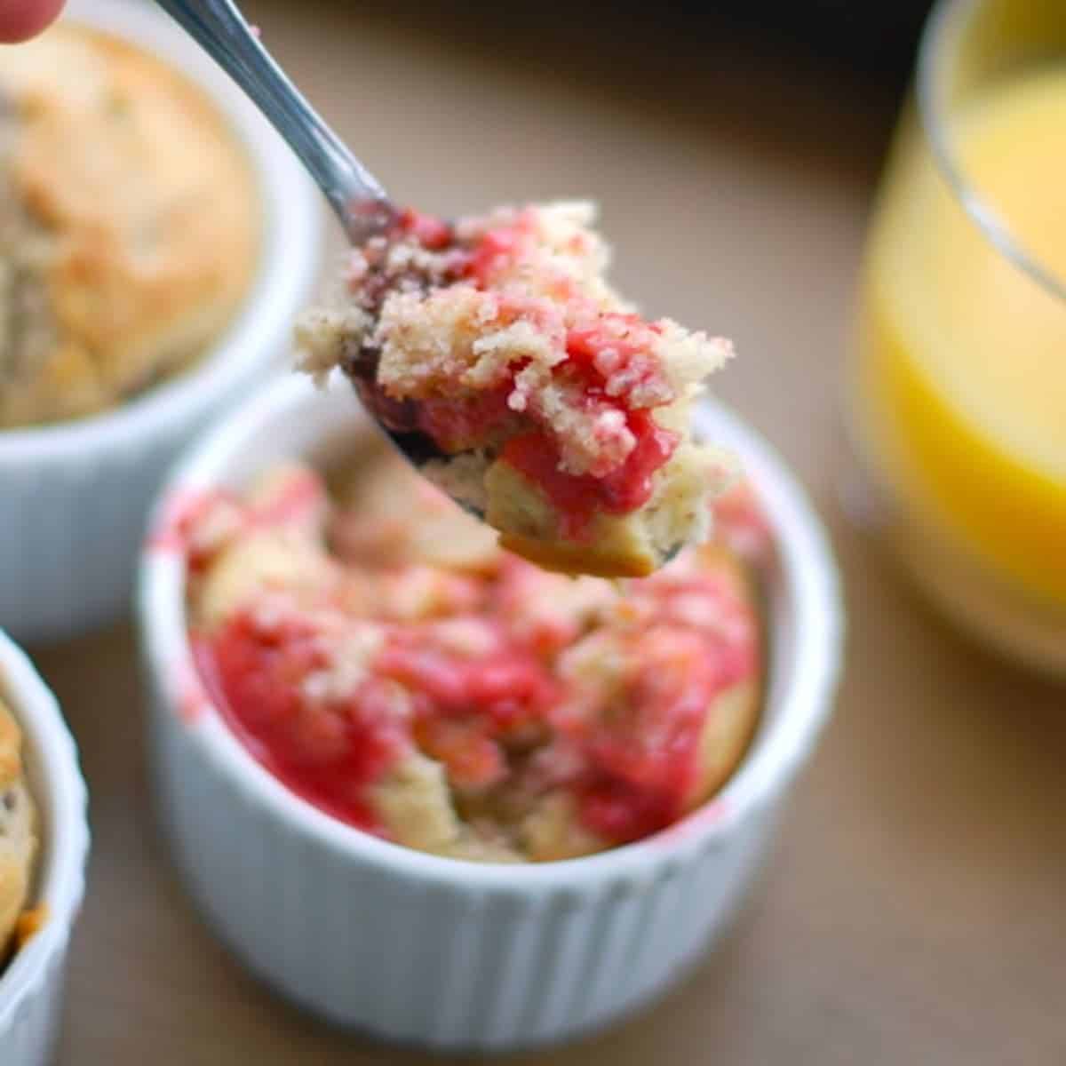 Strawberry breakfast cake on a spoon.