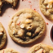 Strawberry white chocolate cookies on a pink background
