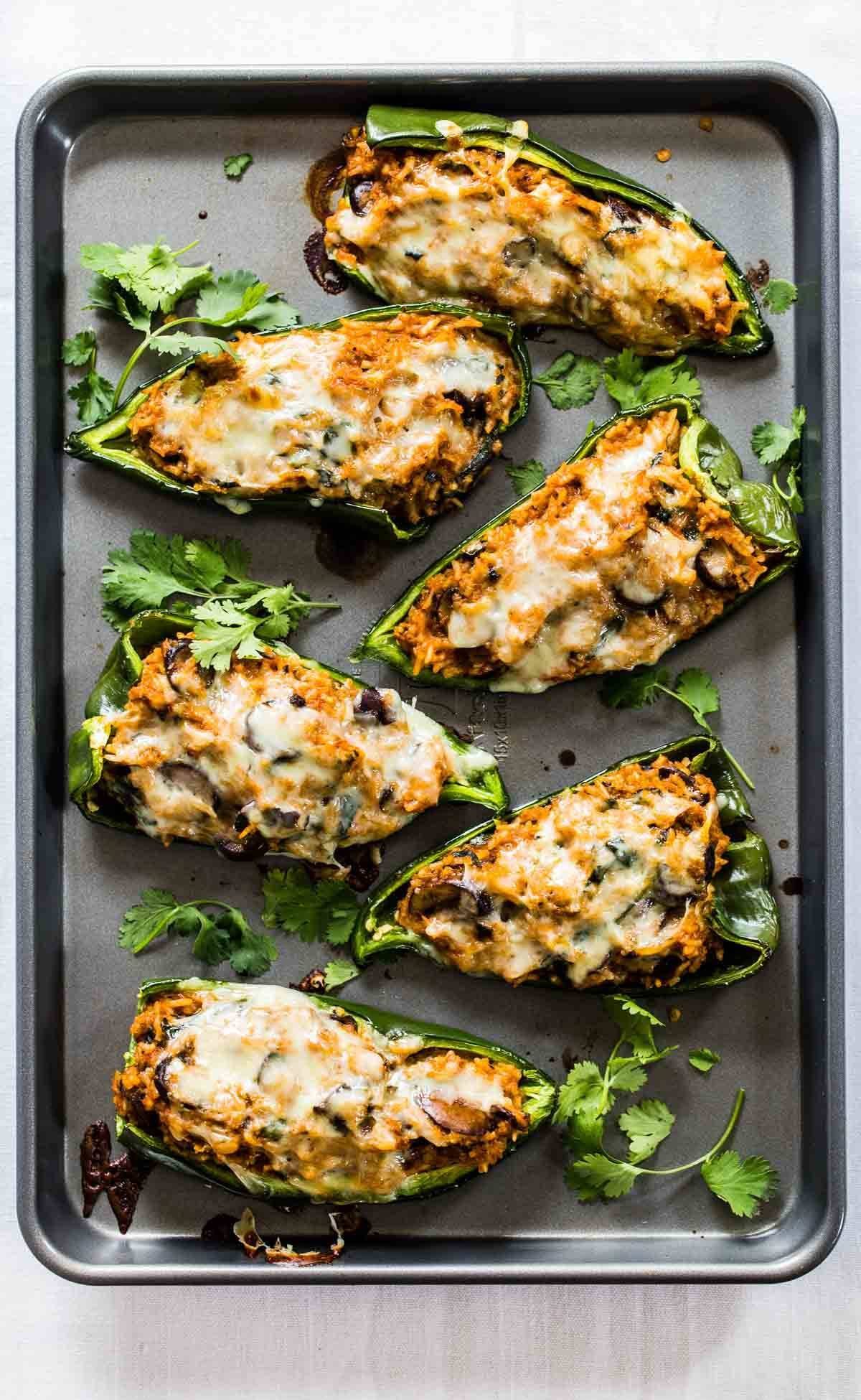 Queso Stuffed Poblanos on a sheet pan.