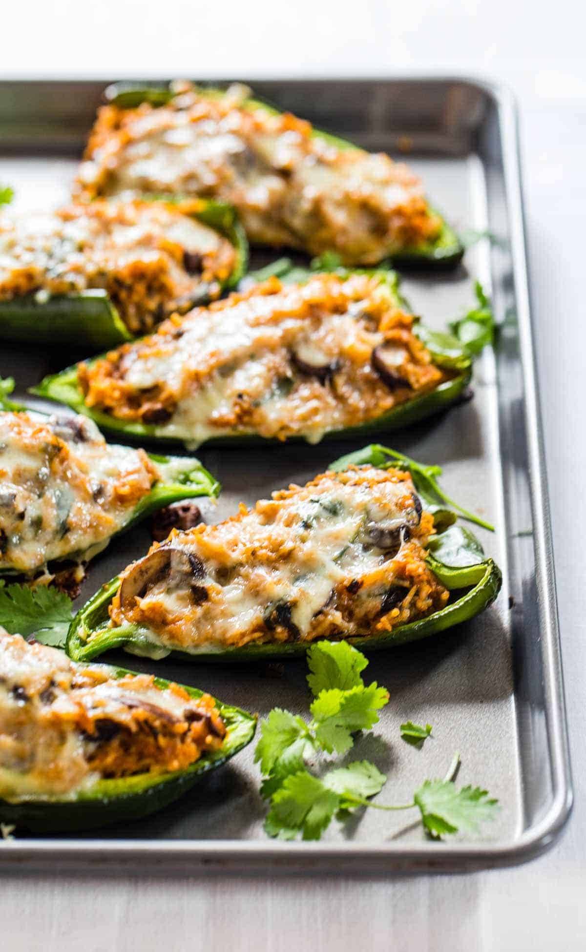Queso Stuffed Poblanos on a sheet pan.