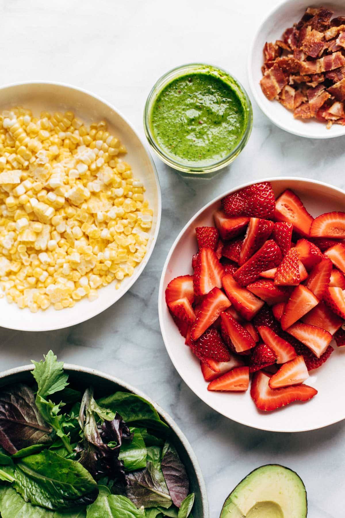 Ingredients in bowls for Summer Chipotle Chicken Cobb Salad.