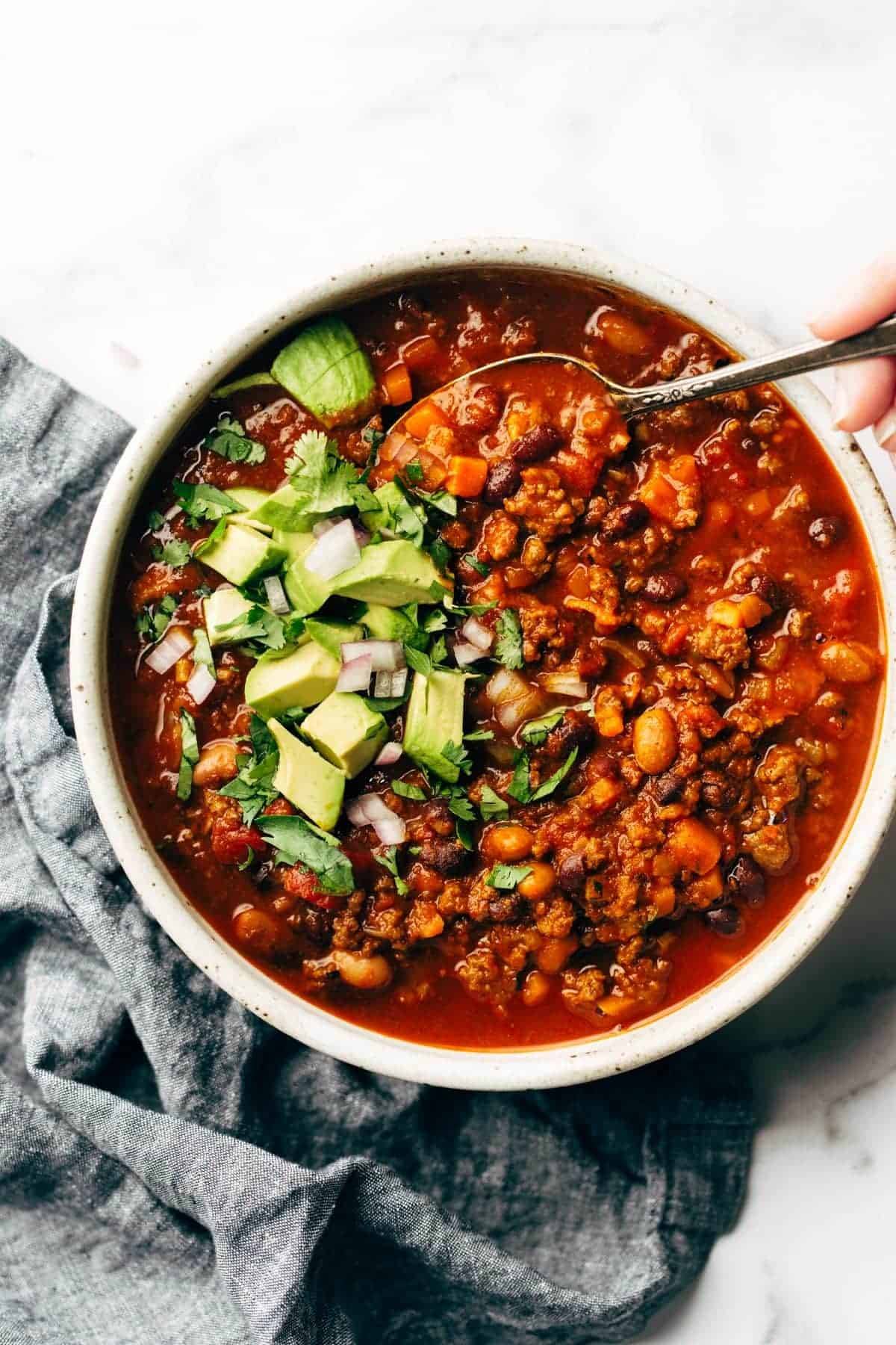 Sunday chili in a bowl with a spoon.