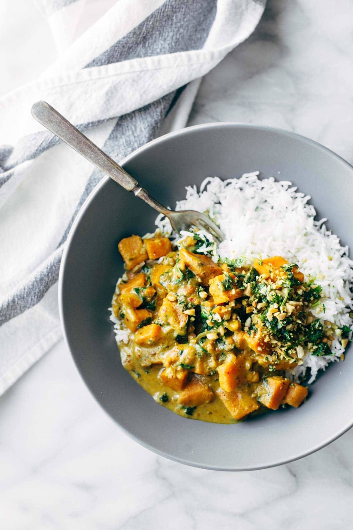 Creamy Thai Sweet Potato Curry in a bowl with rice.