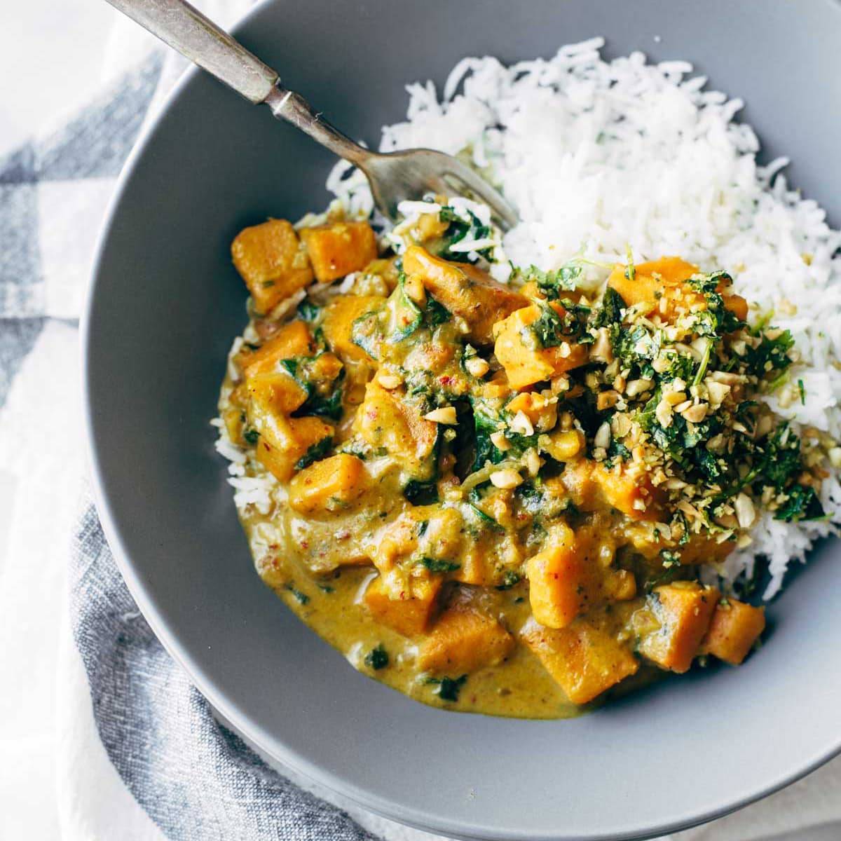 Sweet Potato Curry in a trencher with rice.