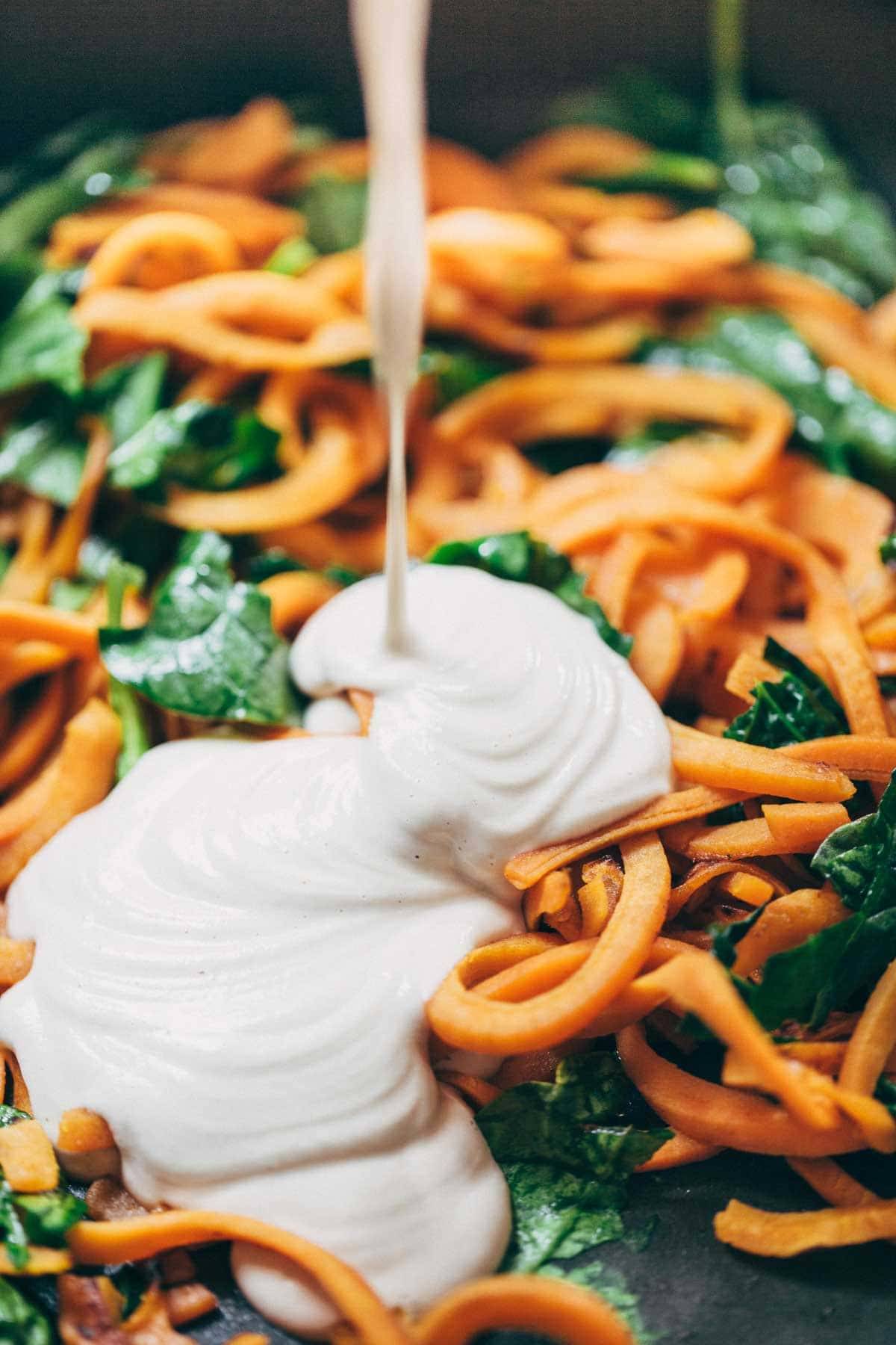 Creamy Spinach and Sweet Potato Noodles with Cashew Sauce - easy to make, adaptable, gluten free, vegan. Devine and delicious! | pinchofyum.com