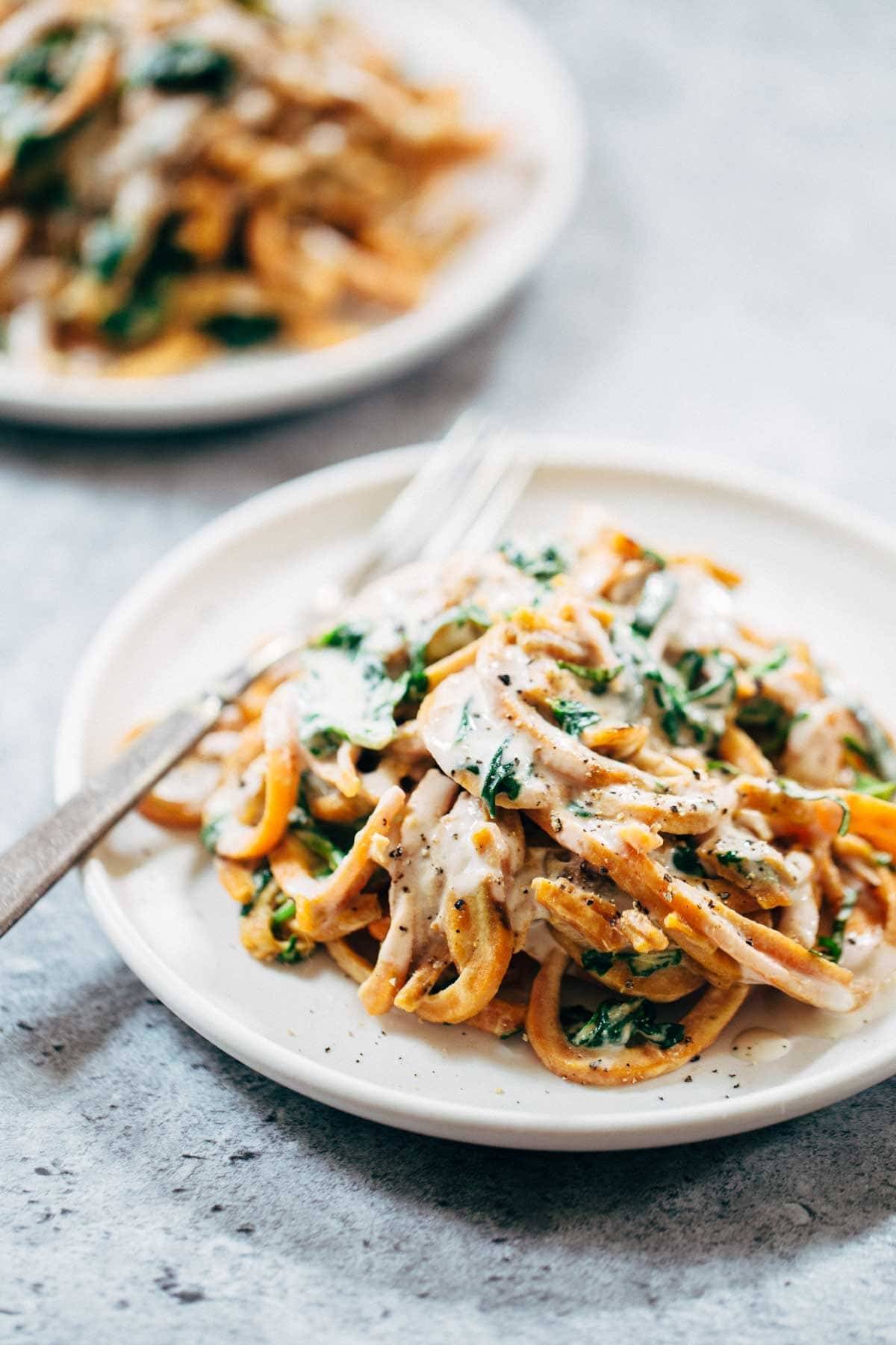 Creamy Spinach and Sweet Potato Noodles with Cashew Sauce - easy to make, adaptable, gluten free, vegan. Devine and delicious! | pinchofyum.com