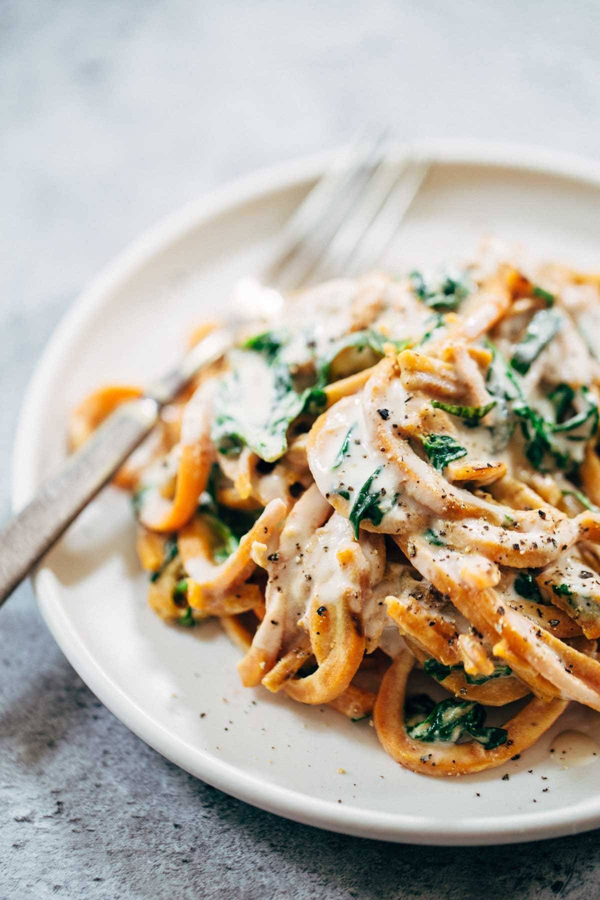 Creamy Spinach and Sweet Potato Noodles with Cashew Sauce - easy to make, adaptable, gluten free, vegan. Devine and delicious! | pinchofyum.com