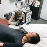Lindsay getting a tattoo.