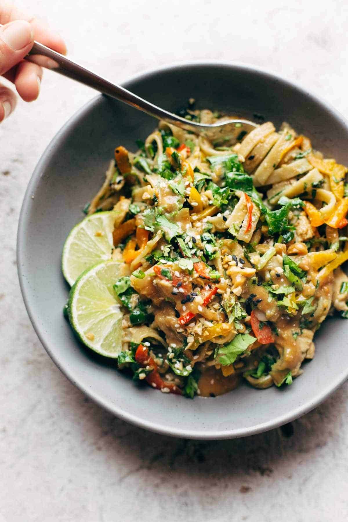 Thai Noodle Salad with Peanut Lime Dressing in a bowl with a fork