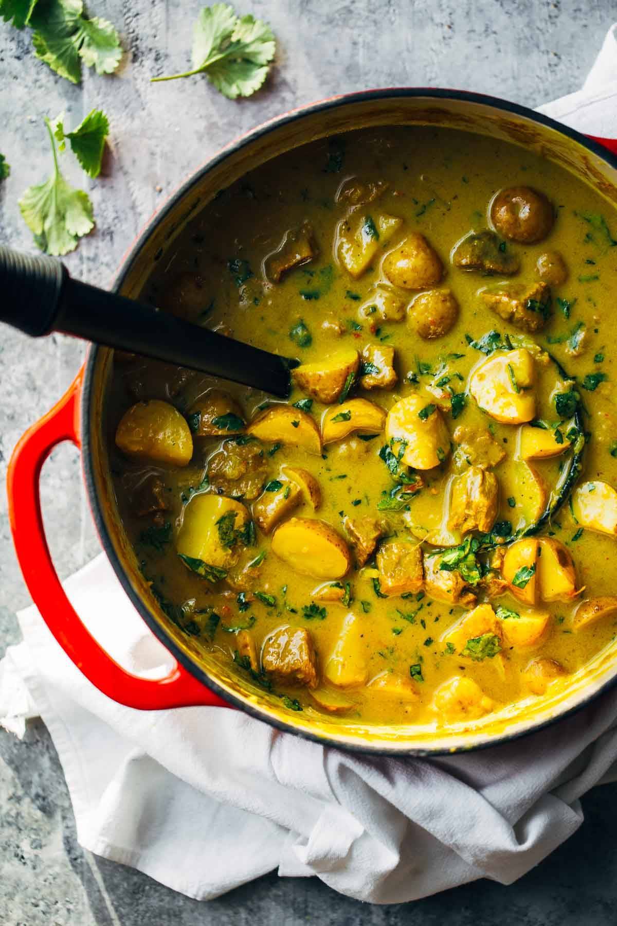 Thai Yellow Curry with Beef and Potatoes in a dutch oven.