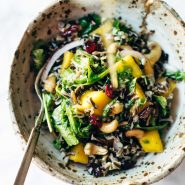 Thanksgiving Salad in a bowl with dressing.