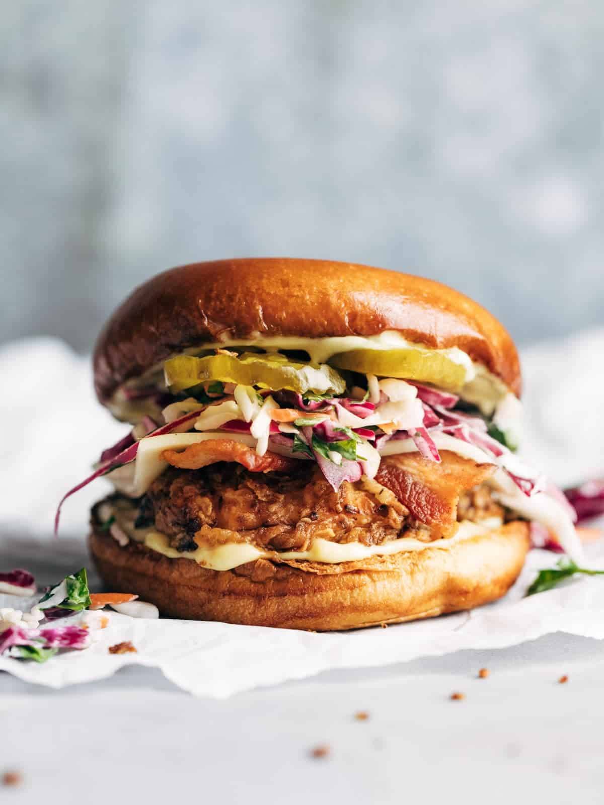 Fried chicken sandwich with slaw and pickles.