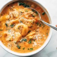 A large bowl of tortellini soup.