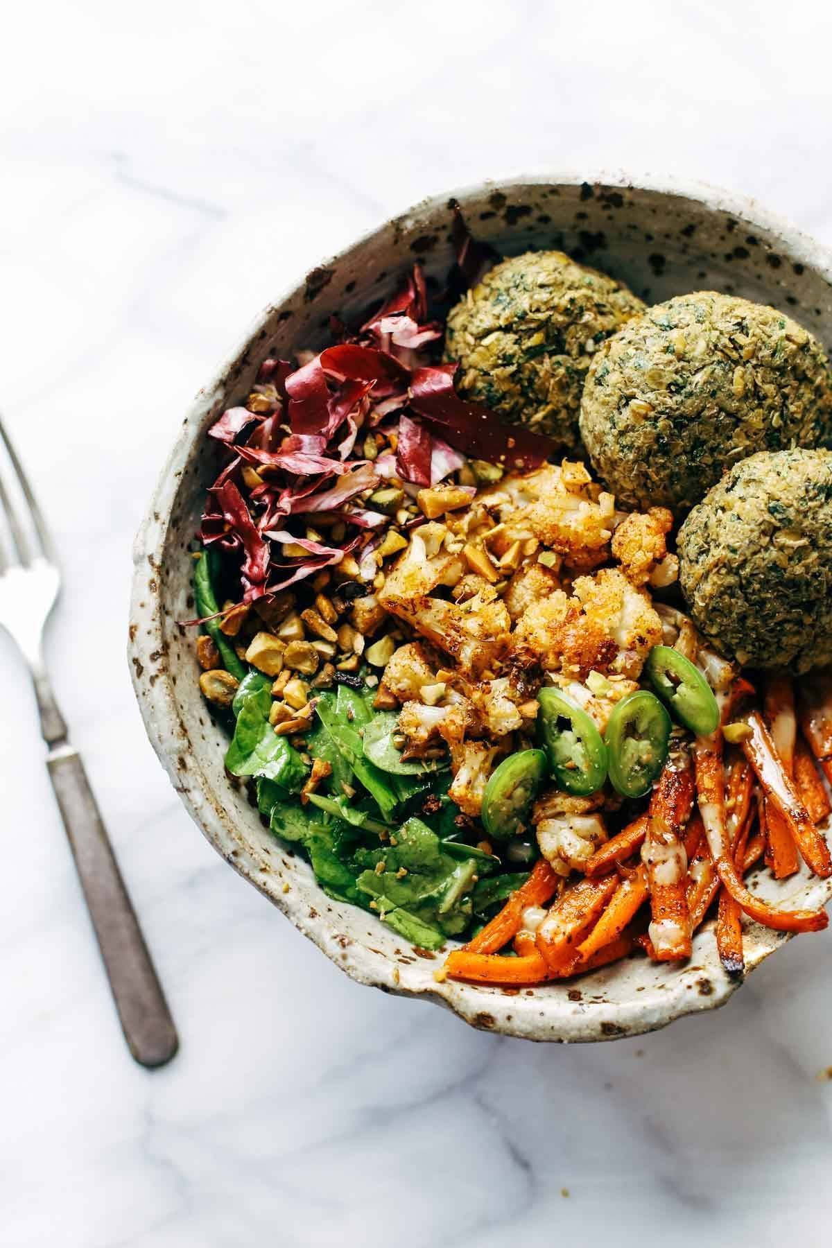 Keep your glow all winter! Easy homemade falafel, roasted veggies, and flavorful sauce all in one big bliss bowl! vegetarian / vegan / gluten free recipe. | pinchofyum.com