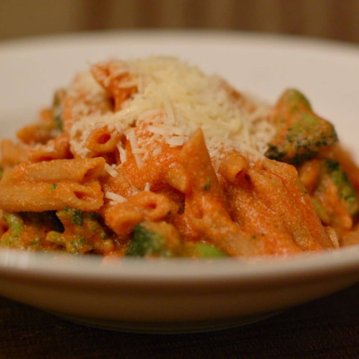 Tomato Ricotta Pasta with Broccoli and cheese in a bowl.