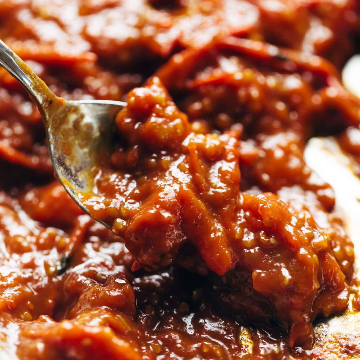 Tomato Butter Sauce in pan with spoon.