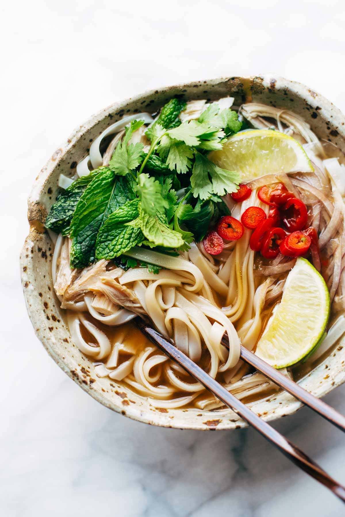 Turkey Pho recipe - LIGHT and so flavorful. All familiar ingredients that can be bought at a mainstream grocery store. Perfect for leftover turkey! | pinchofyum.com