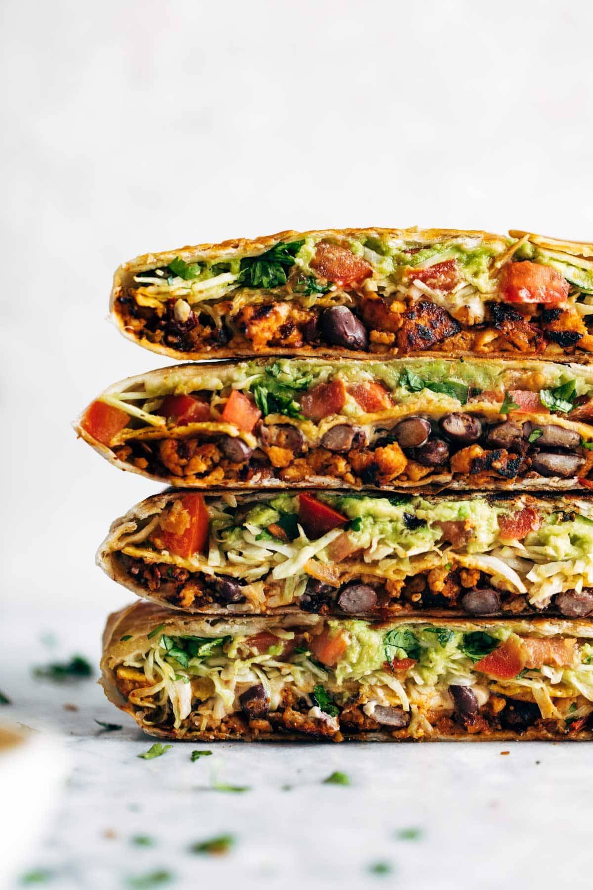 This vegan crunchwrap is INSANE! Stuff this bad boy with whatever you like - I made it with sofritas tofu and cashew queso - and wrap it up, fry, and devour! Favorite vegan recipe to date. #vegan #veganrecipe #crunchwrap #vegancrunchwrap #sofritas #cashewqueso