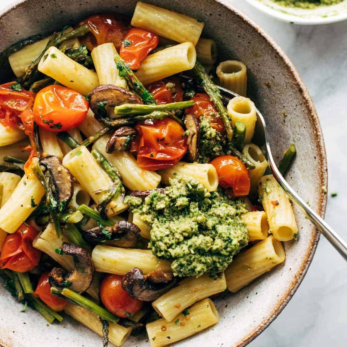 Rigatoni noodles with roasted veggies and pesto sauce.