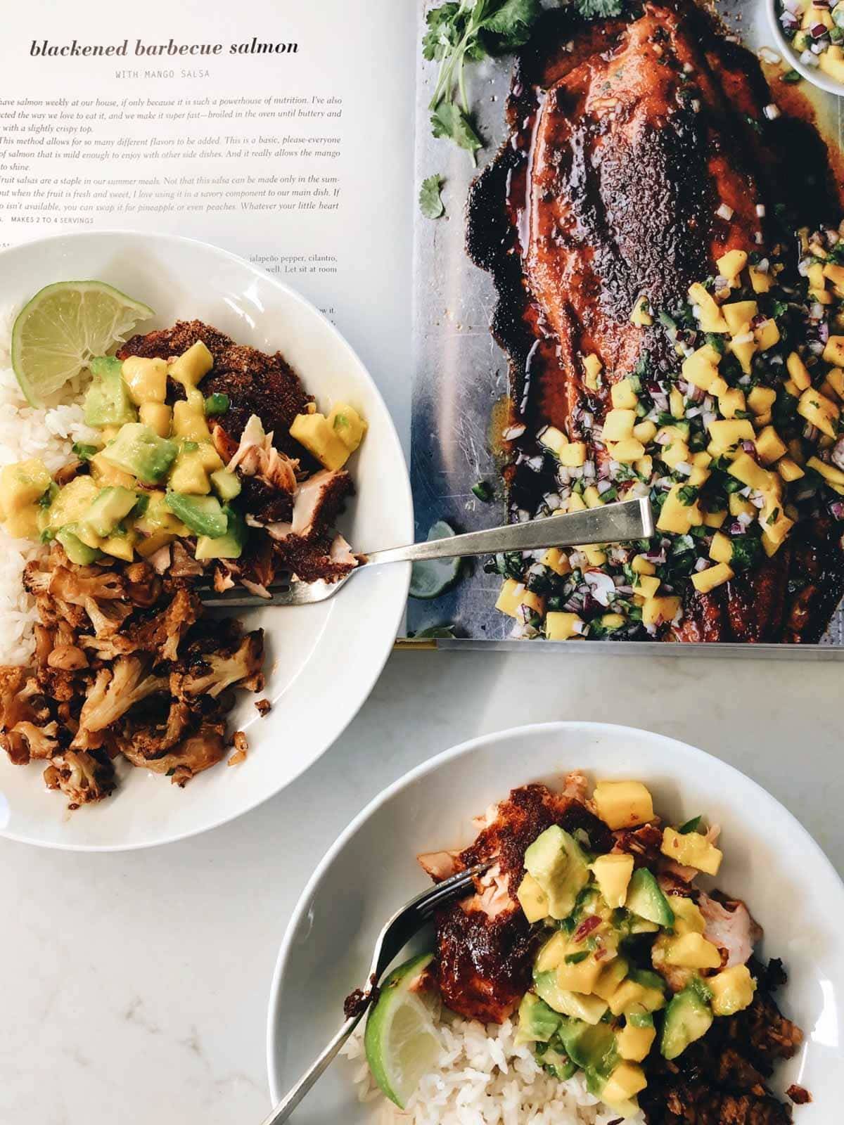BBQ Salmon in a bowl with cookbook.