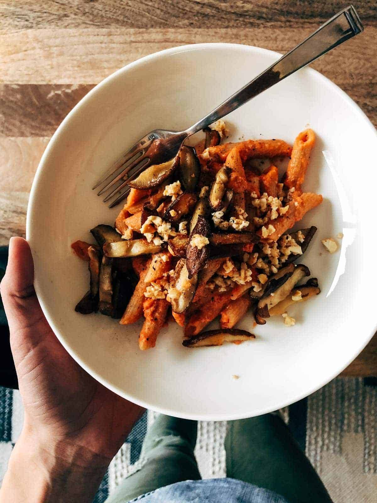 Pasta and mushrooms in a bowl.