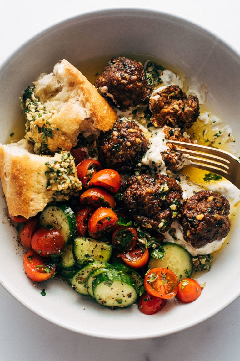 Sheet Pan Meatballs with Tomato Salad and Green Sauce Recipe - Pinch of Yum