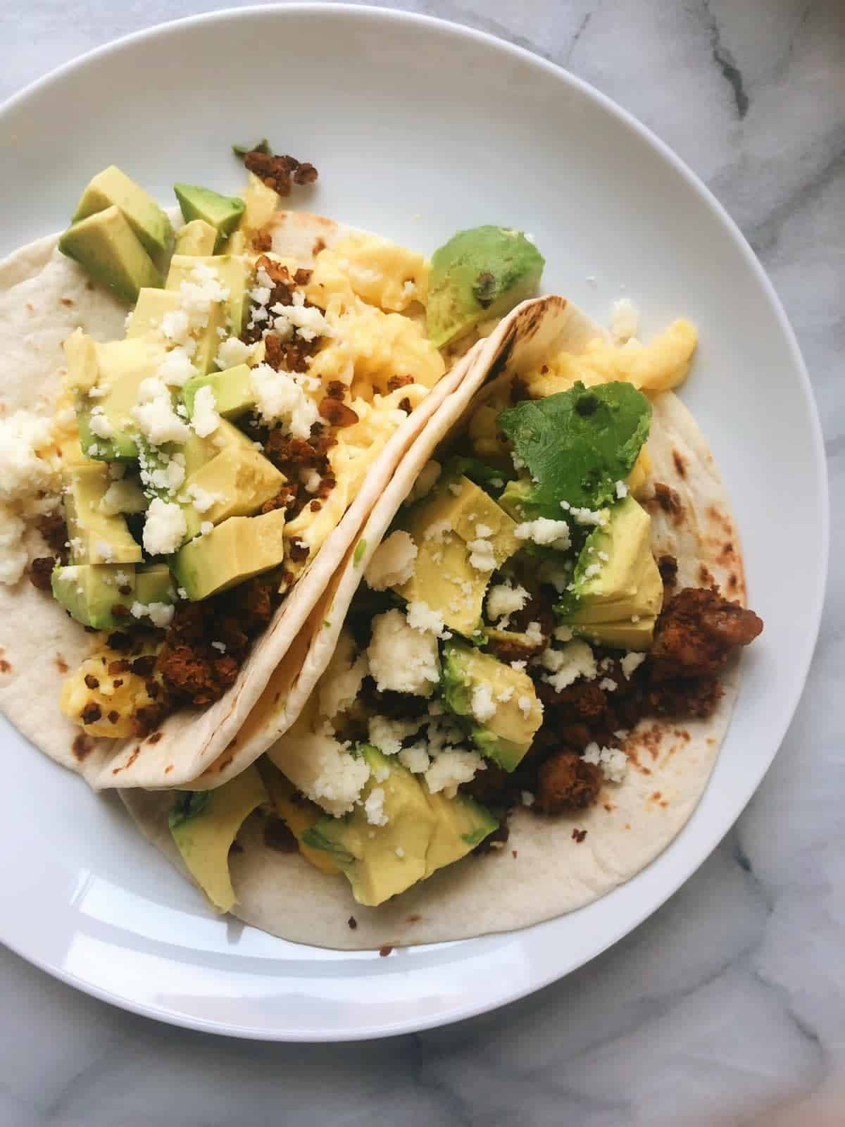Breakfast tacos on a plate.